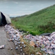 Screenshot of overturned truck with beer all over highway